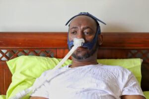 man wearing a sleep apnea mask
