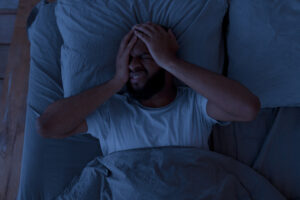 image of a man with insomnia at night