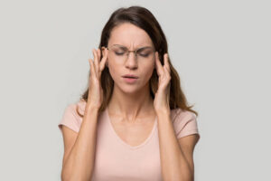 a woman having a migraine